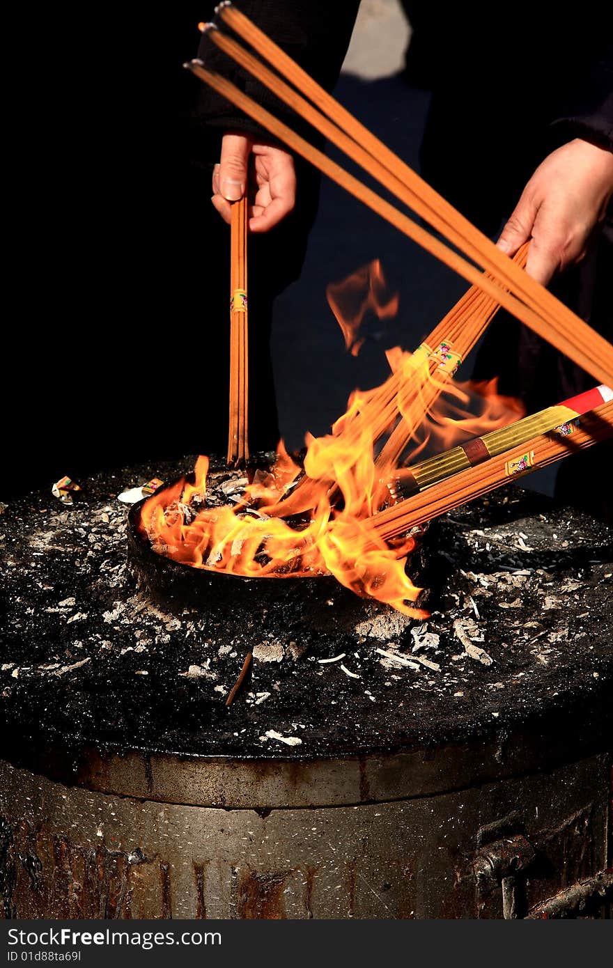 Flame and incense in a Chinese temple.