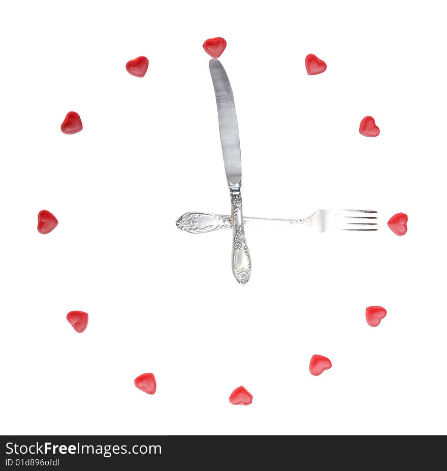 Clock made from fruit jellies and dishware, show meal time, isolated on white. Clock made from fruit jellies and dishware, show meal time, isolated on white