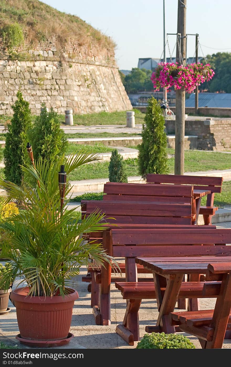 Outdoor cafe tables by river. Outdoor cafe tables by river