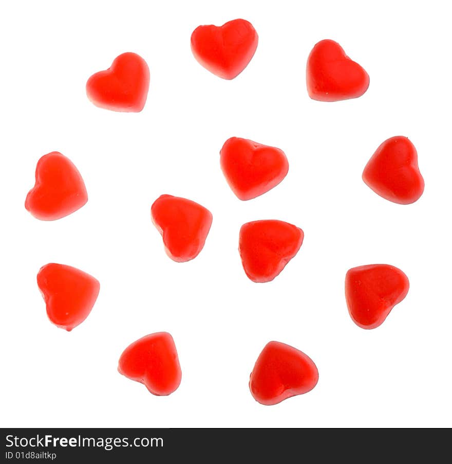 Many heart shaped fruit jellies, located on circle, isolated on white. Many heart shaped fruit jellies, located on circle, isolated on white