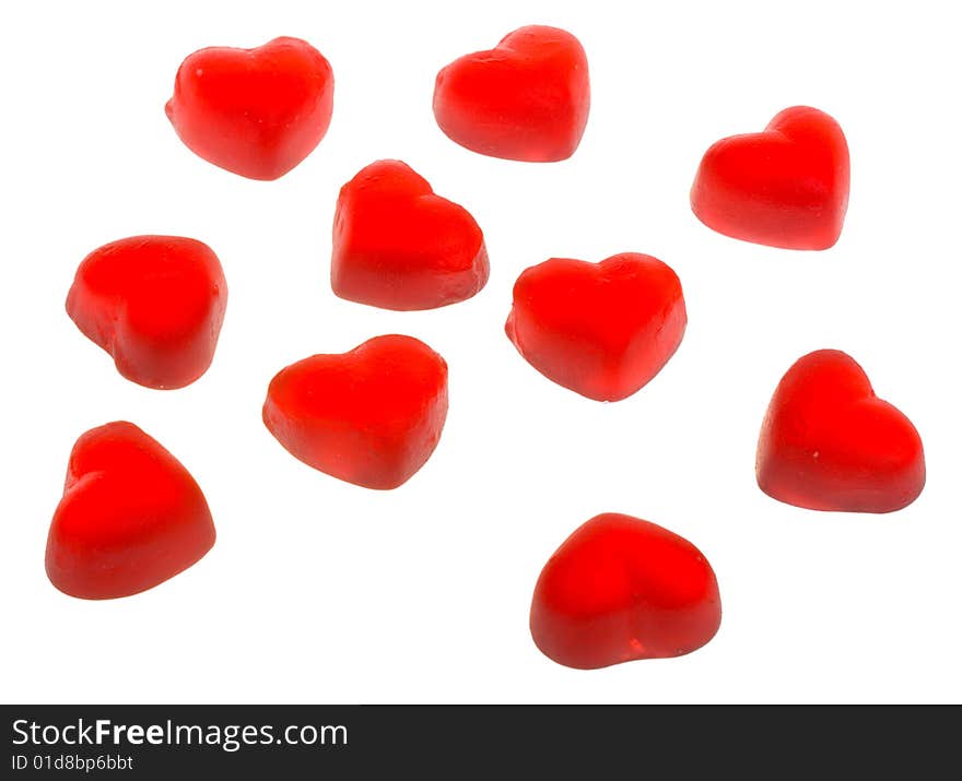 Ten heart shaped fruit jellies, located on circle, isolated on white