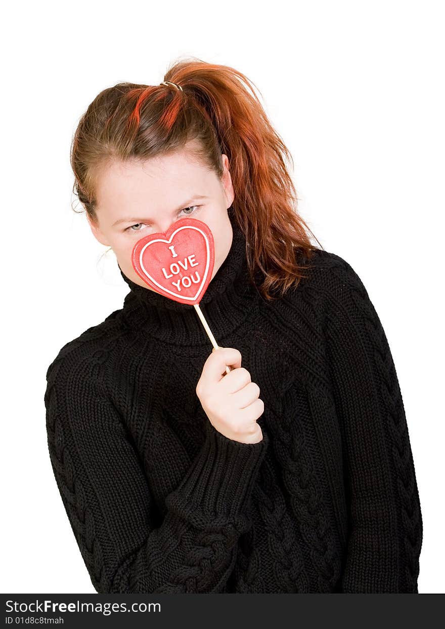 Girl with red heart shaped candy