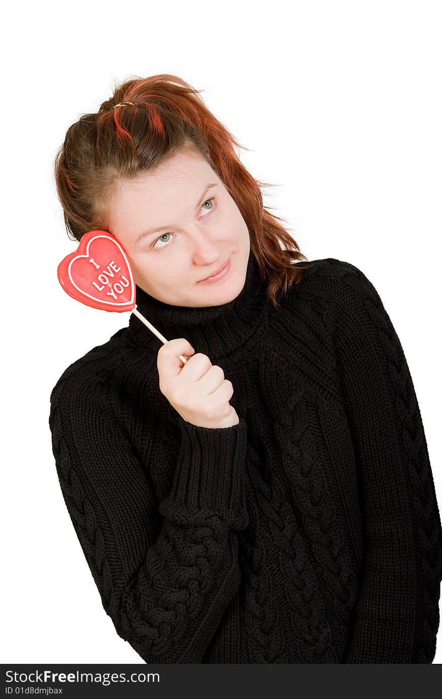 Girl with red heart shaped candy