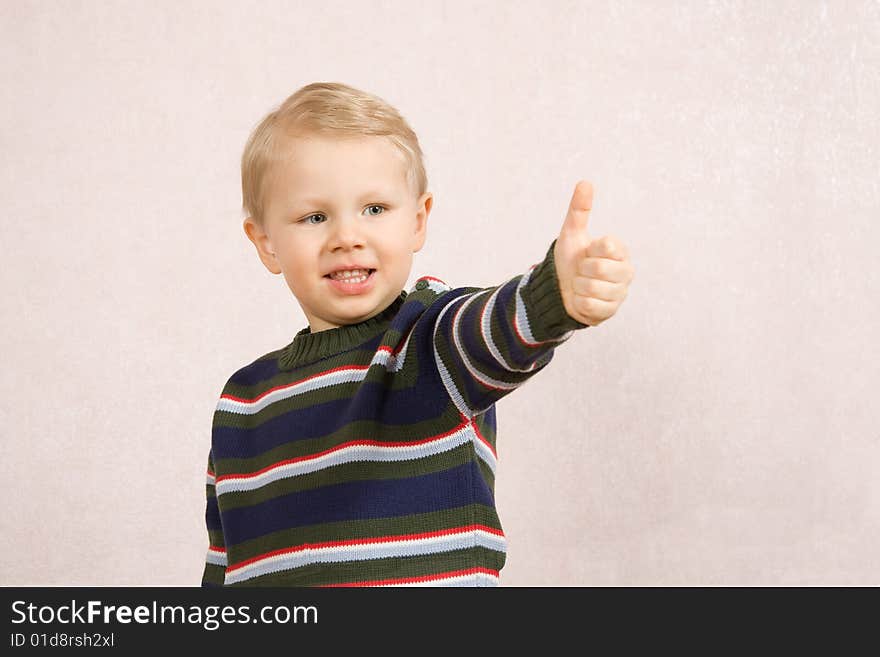 Cheerful little boy shows his positive future. Cheerful little boy shows his positive future