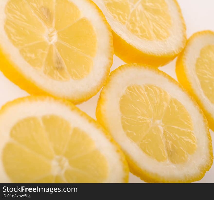 Slices of lemon isolated on white background