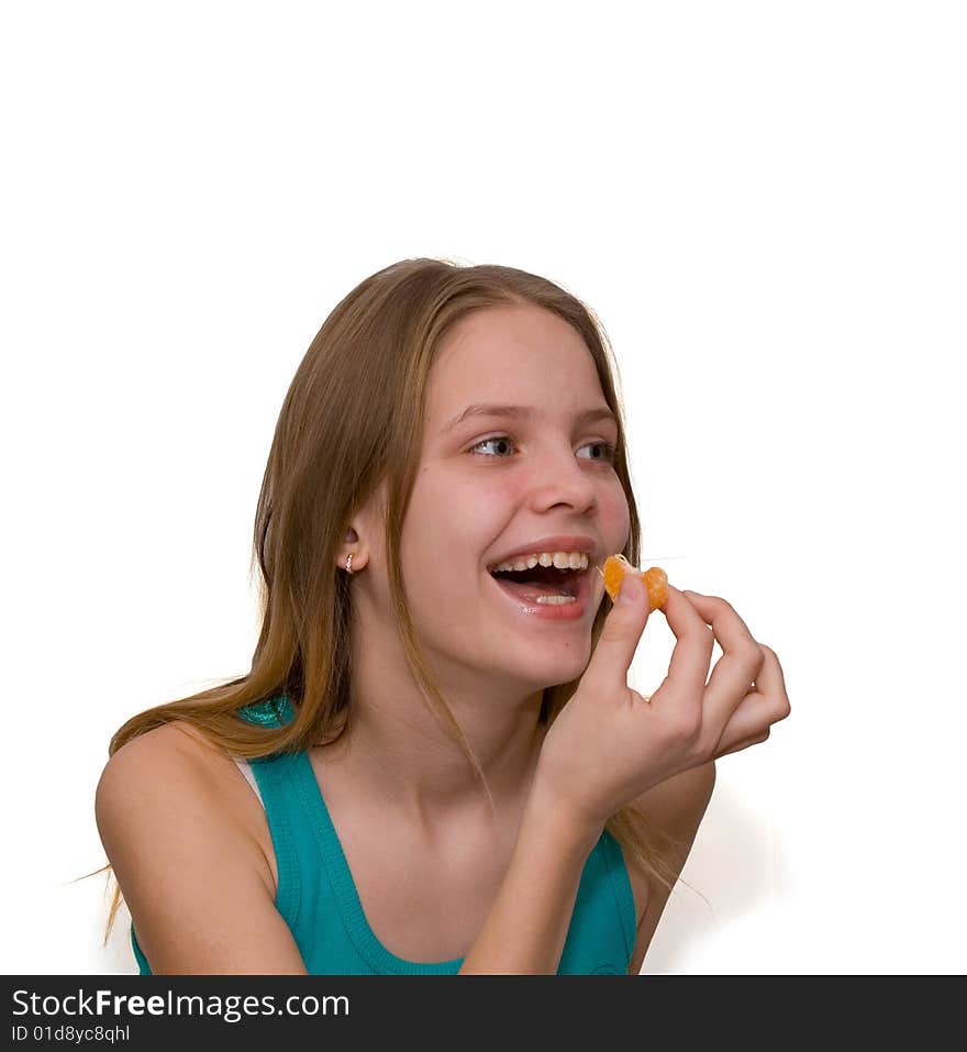 Young girl with tangerine on white