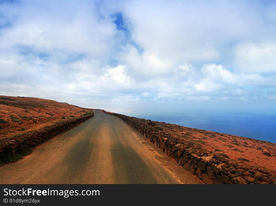 Road under blue skies, Canary Island Lanzarote. Road under blue skies, Canary Island Lanzarote