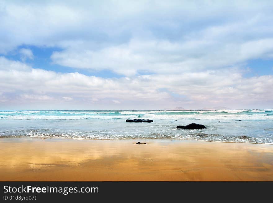 Atlantic  stony shore of Canary Island Lanzarote. Atlantic  stony shore of Canary Island Lanzarote