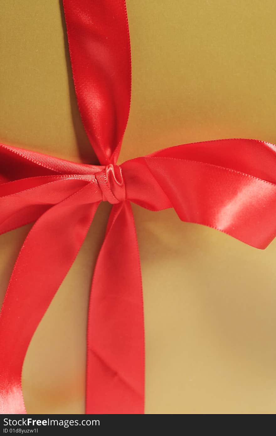 Gift box with red ribbon isolated on white