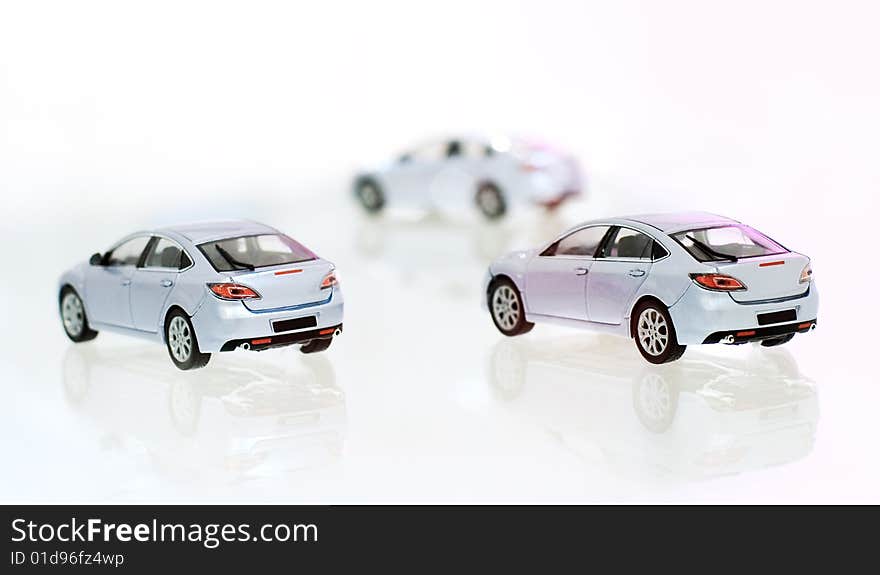 Three model's of car on glass material. Three model's of car on glass material