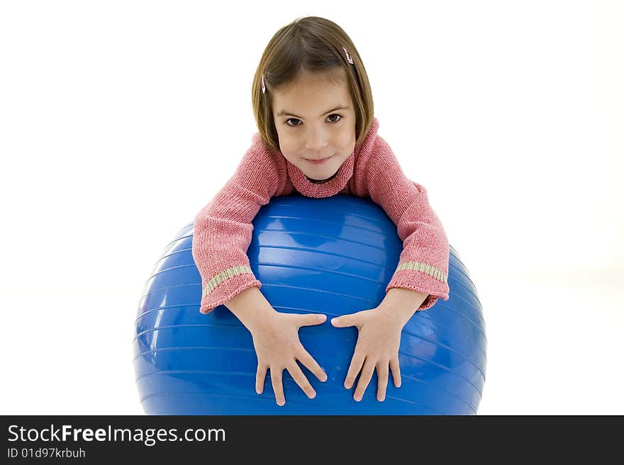 Little girl with a big blue ball