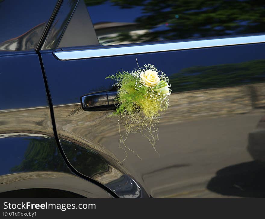 Limousine decorated with flowers near the wedding ceremony. Limousine decorated with flowers near the wedding ceremony