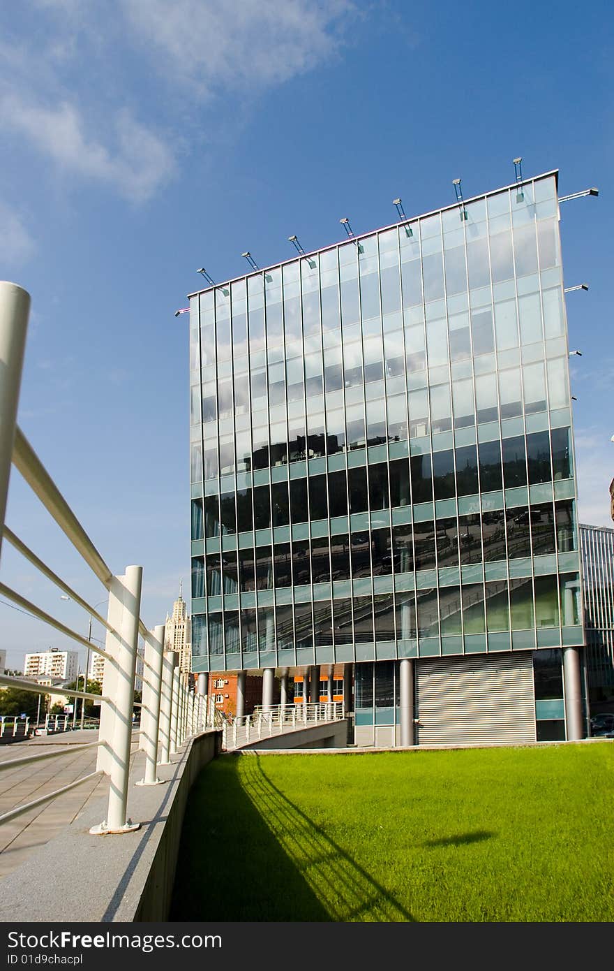 Modern architecture with glass facade on sky background