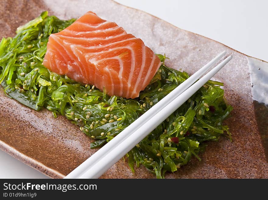 Salmon Sashimi and Chopsticks close-up