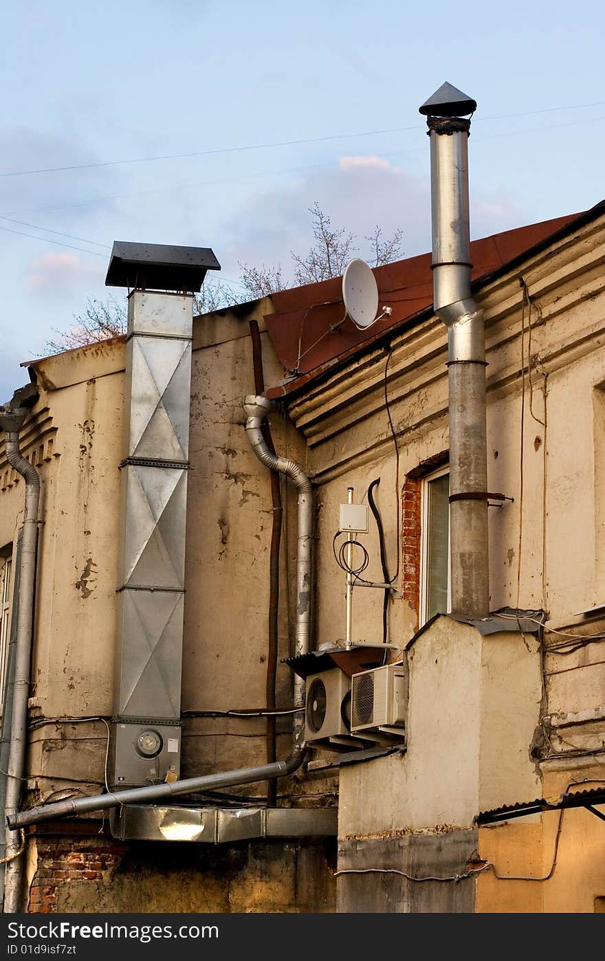 A view of a back yard of a city house. A view of a back yard of a city house