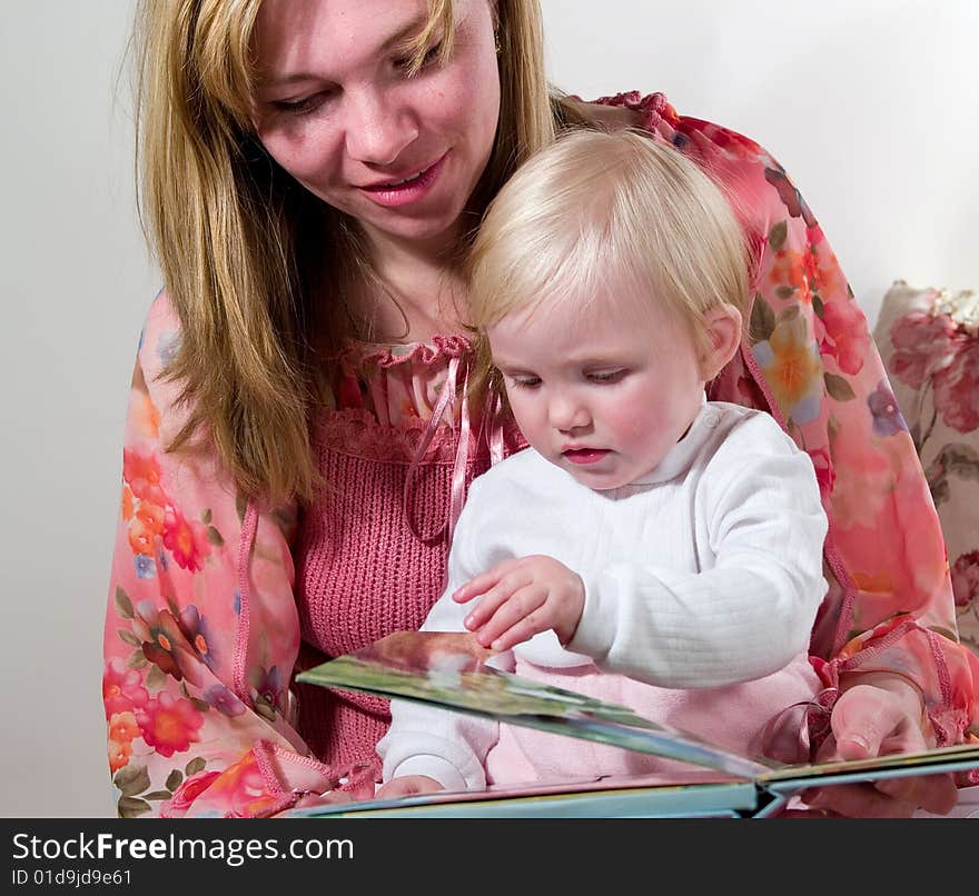 Mother with child read book