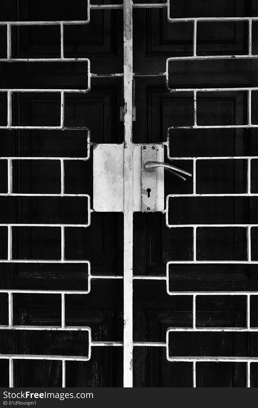 Monochrome abstract of an old rusty metal gate