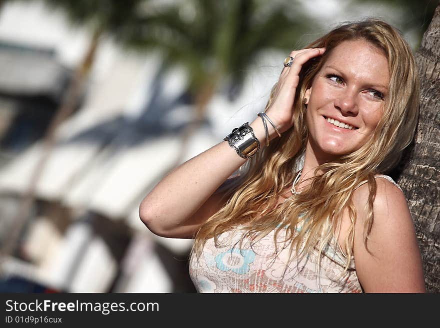 Young woman smiling and looking over her shoulder. Young woman smiling and looking over her shoulder