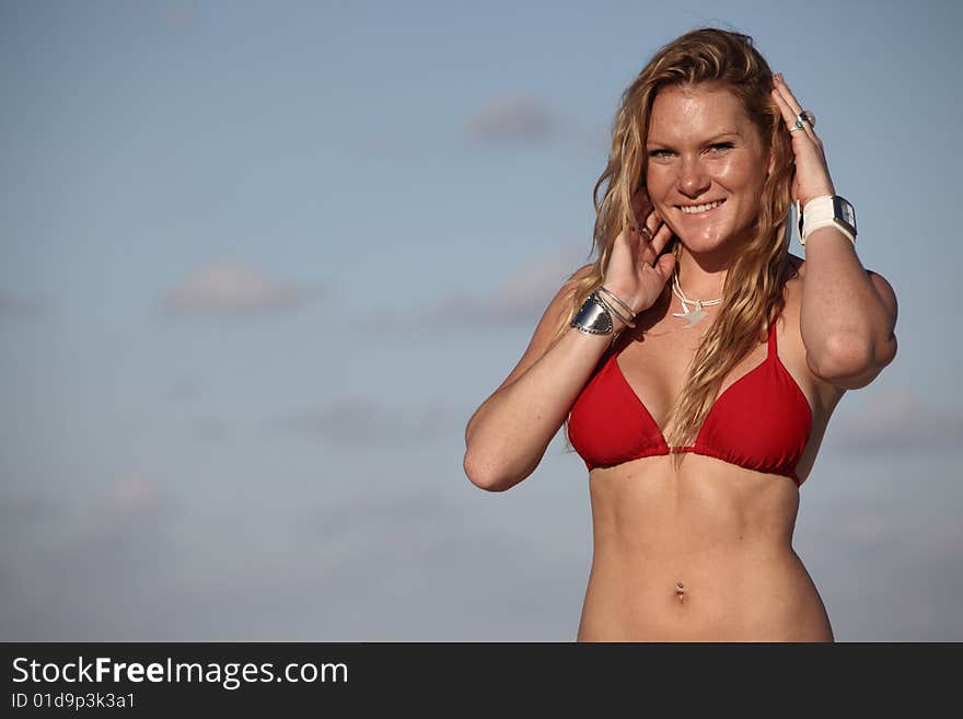 Woman posing on a sky background