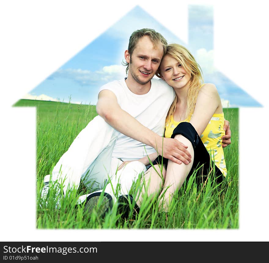 Man and woman in house on green field  under blue sky. Man and woman in house on green field  under blue sky