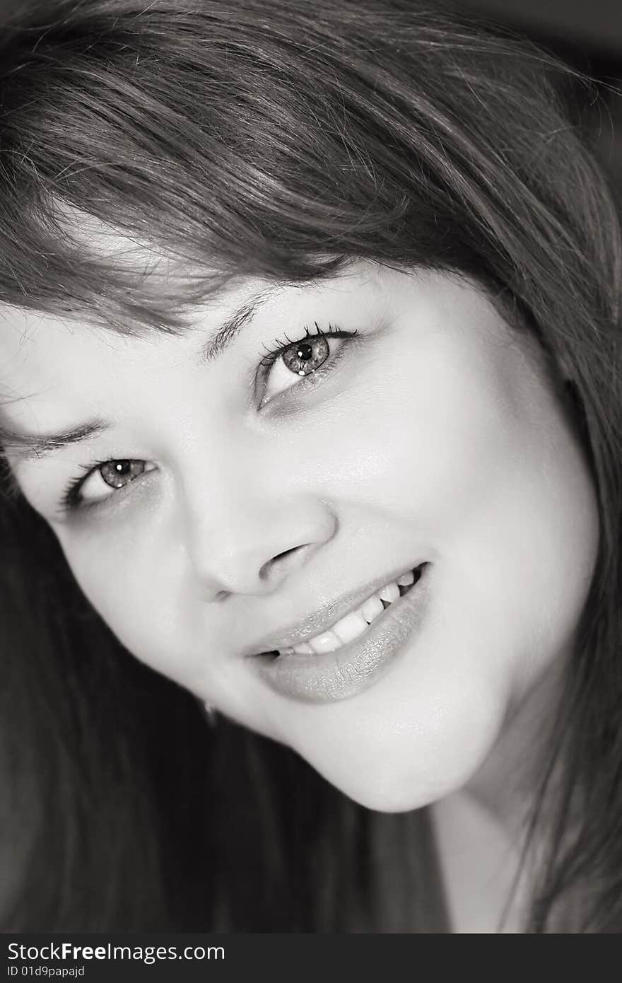 Black and white portrait of a pretty, smiling woman. Black and white portrait of a pretty, smiling woman