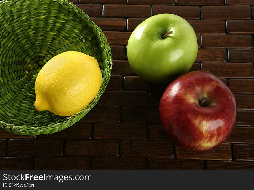 Varied fruits and vegetables, yellow lemon and apple