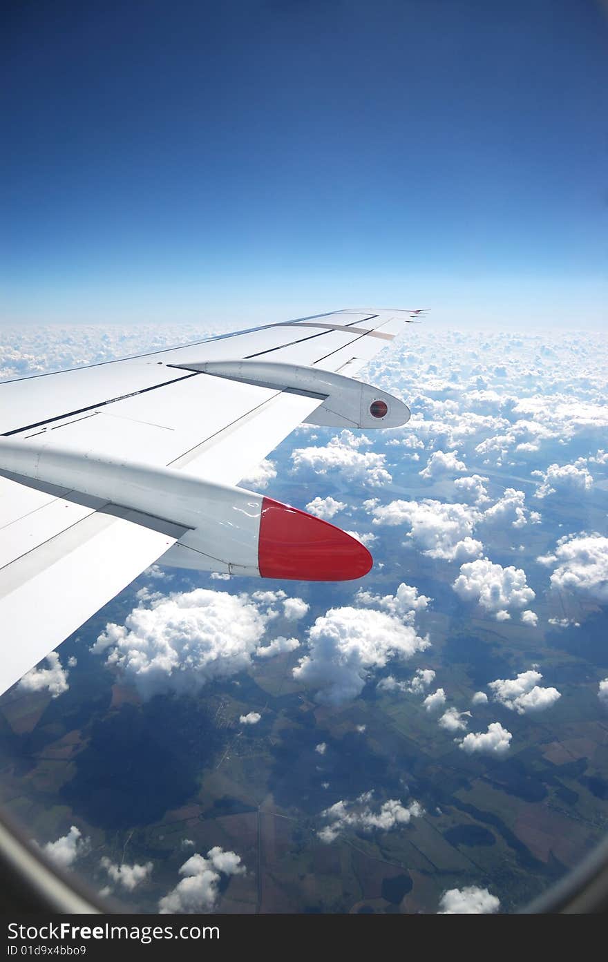 View from aircraft window to the Earth