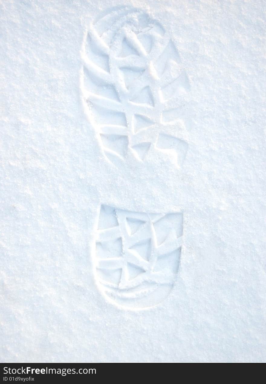 Footprint on white clean snow. Footprint on white clean snow