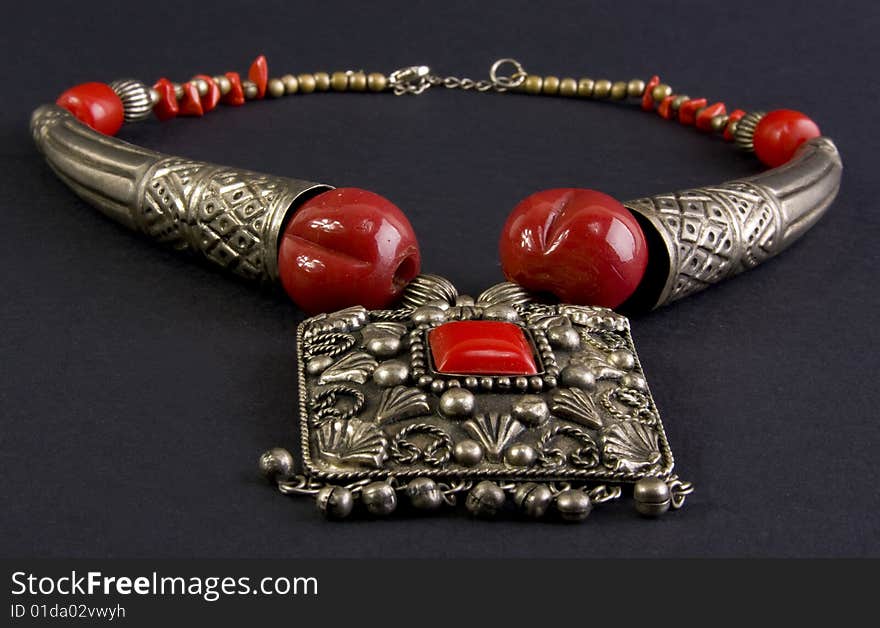 Metal necklace close-up isolated on a dark background