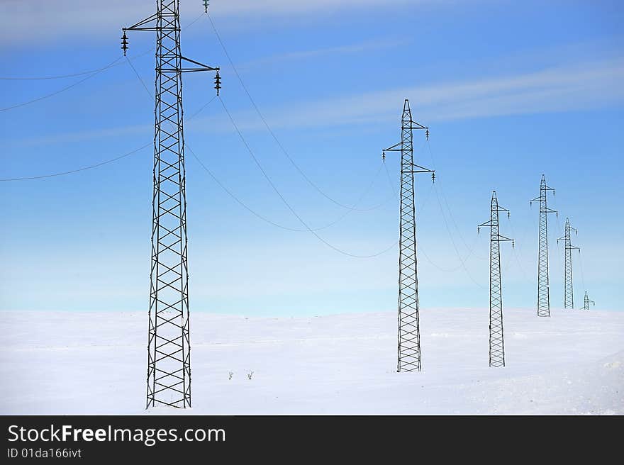 Electric long distance line on the snow. Electric long distance line on the snow