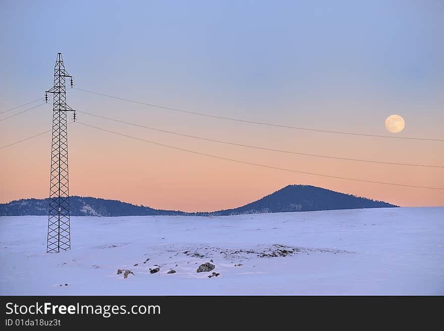 Electric long distance line on the snow. Electric long distance line on the snow