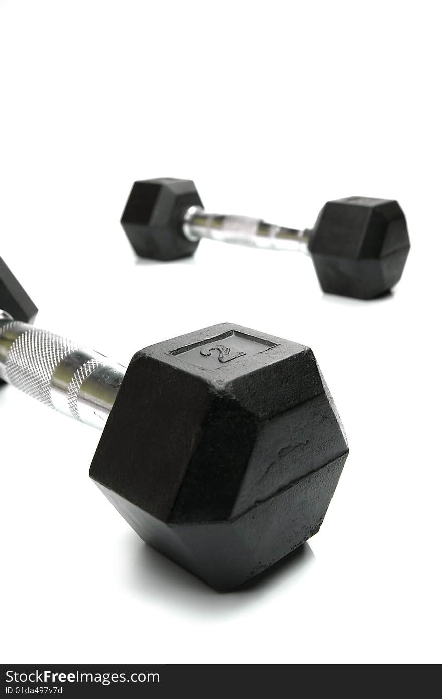 Weight lifting dumbbells isolated against a white background