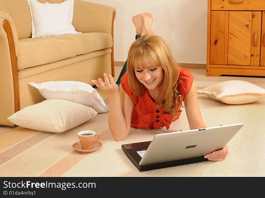 Young woman at home, lying on her sofa. Young woman at home, lying on her sofa.