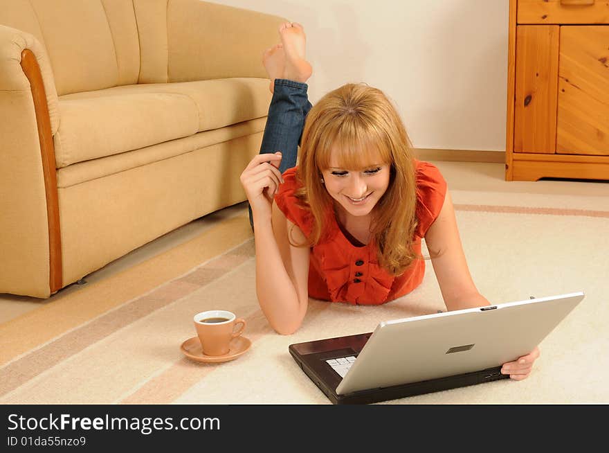 Young woman at home, lying on her sofa. Young woman at home, lying on her sofa.