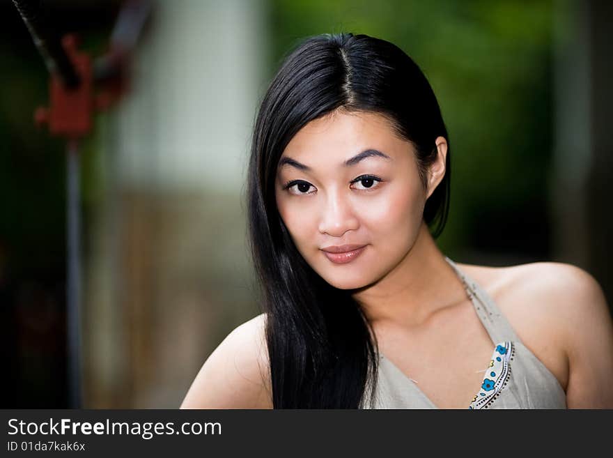 Asian Woman Relaxing On The Outdoor