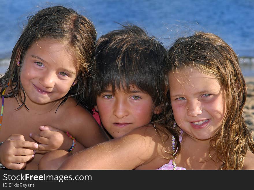 Three brothers in the beach posing