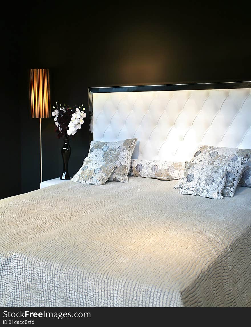 Luxury bed in interior in contemporary style. Luxury bed in interior in contemporary style