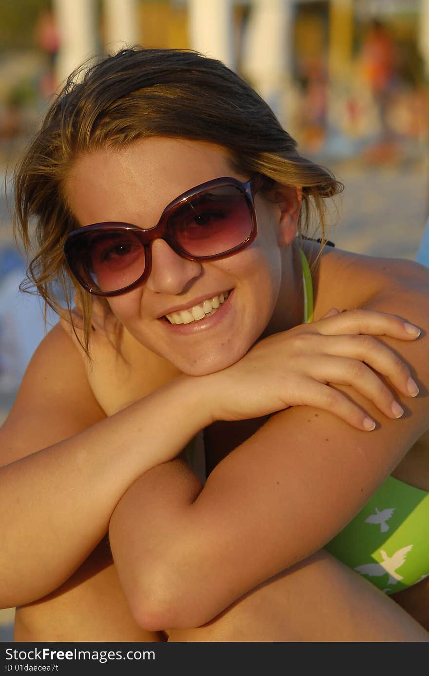 Young girl with sunglasses on the beach. Young girl with sunglasses on the beach