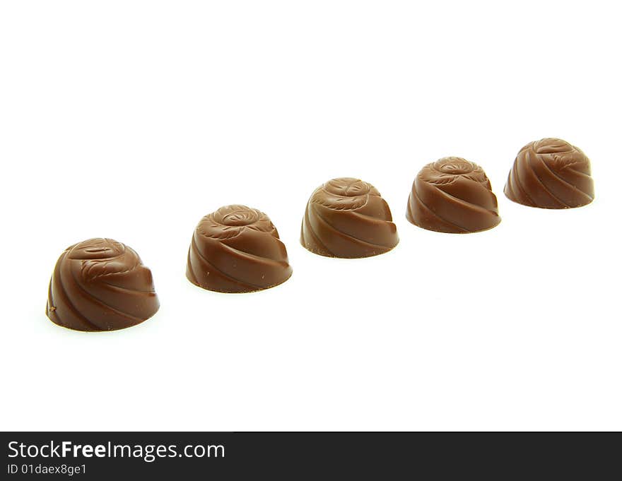 Delicious chocolate pralines isolated on white. Delicious chocolate pralines isolated on white