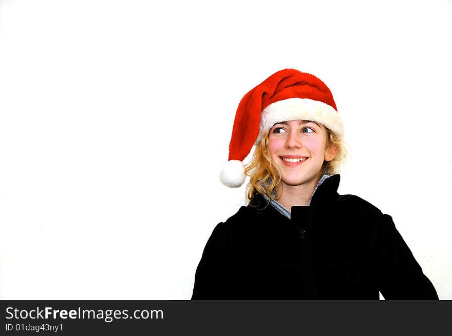 Pretty teenager with santa hat agains white background. Pretty teenager with santa hat agains white background