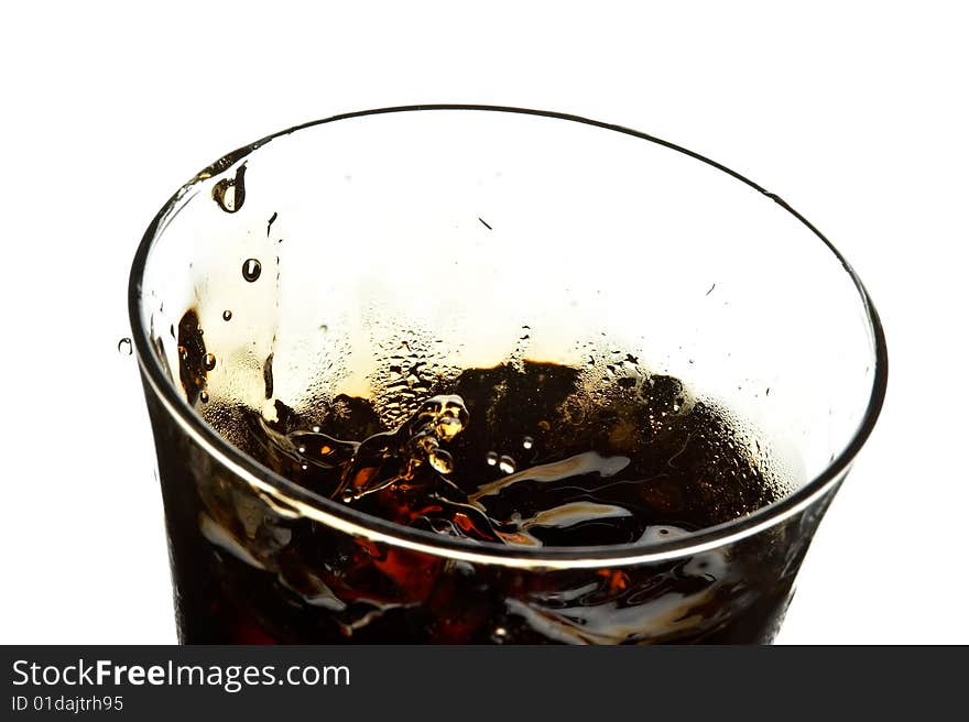 Glass with cola and ice on the white background