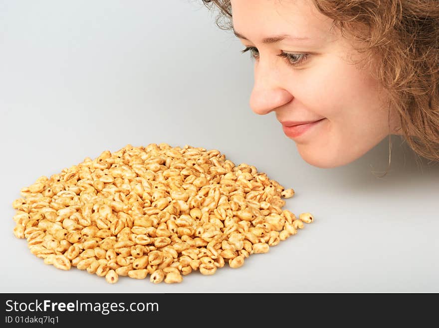 Popped wheat grains and girl