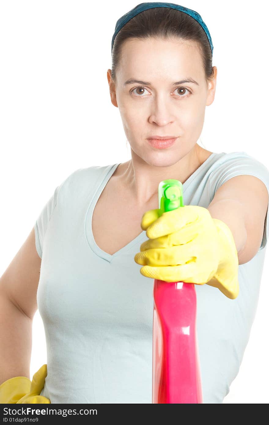 A woman in domestic household role with a detergent spray on white. A woman in domestic household role with a detergent spray on white