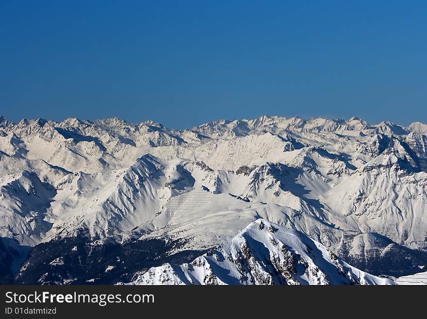 Bright sunny day. Winter mountains.