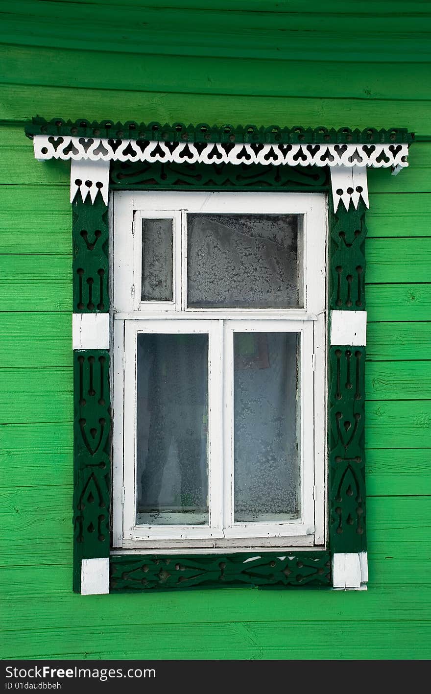 House window in the Russian village, decorated with a carving. House window in the Russian village, decorated with a carving.