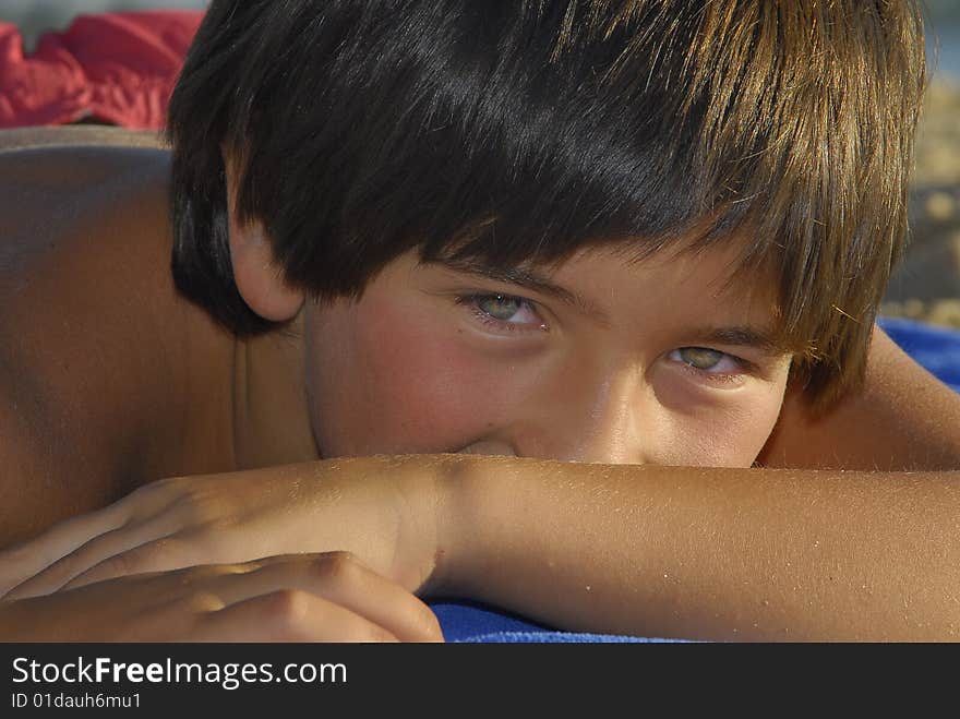 Young boy posing in the beach. Young boy posing in the beach