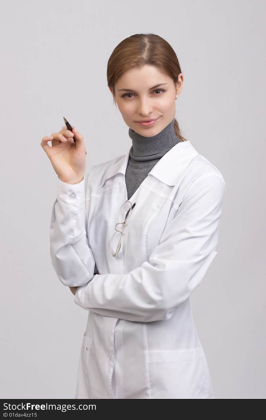 Young beautiful doctor on the white background