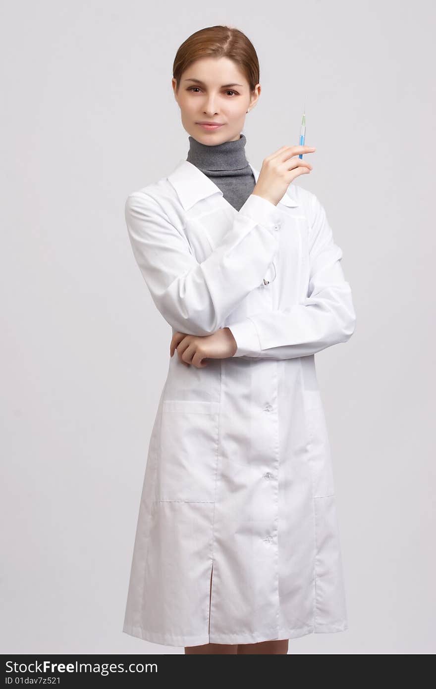 Young beautiful doctor on the white background