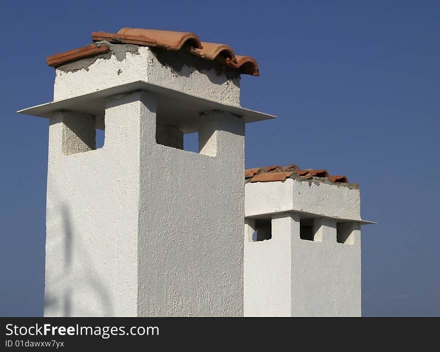 Ð¡himneys on the roof in Crete, Greece