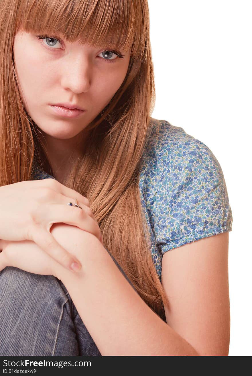 Young girl holding her knee on white background